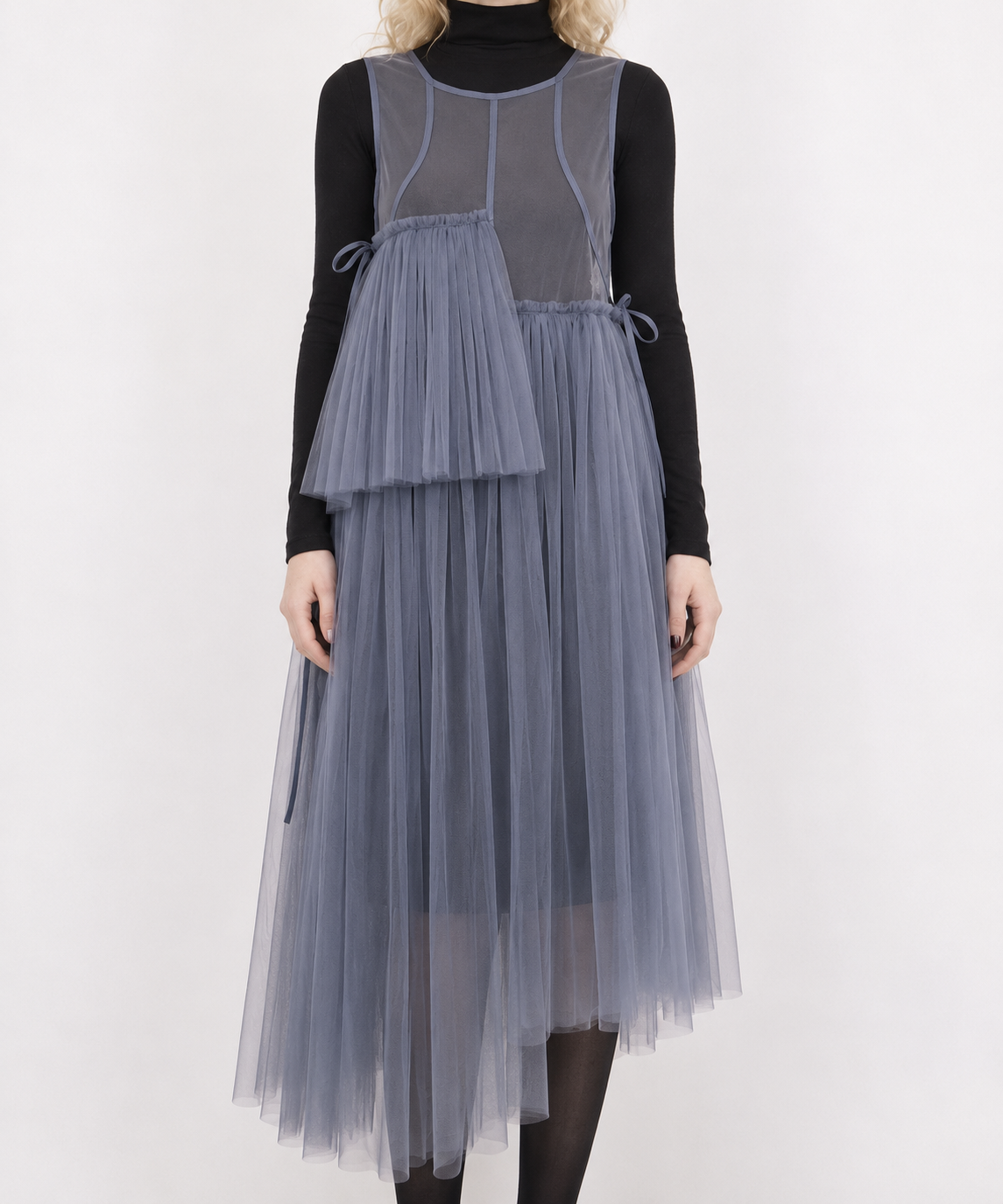 Blue-violet mesh dress detail showing the side ties, fine pleats, sheer skirt and asymmetric hem.