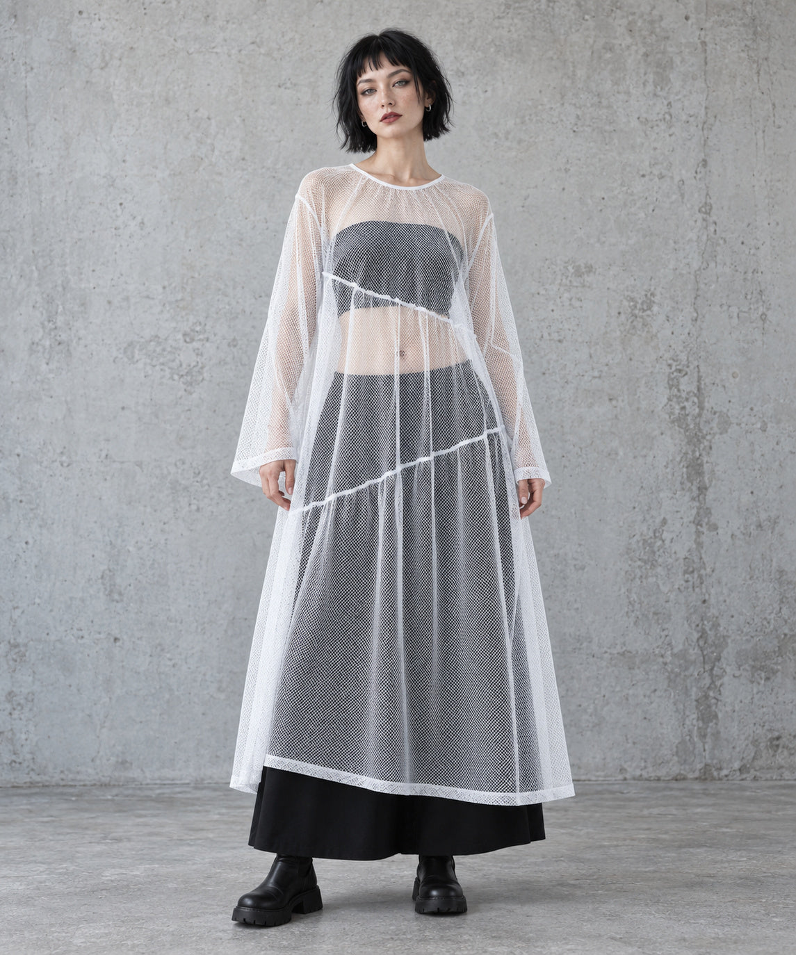 White layered gauze A-line maxi dress, full-length front view styled over a black bandeau and long skirt.