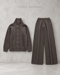 Coffee brown knitted cardigan and wide-leg trousers set displayed flat against a light concrete background.